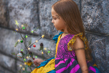 Load image into Gallery viewer, Side view of sally inspired boutique dress for girls with colorful patchwork skirt