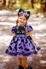 Load image into Gallery viewer, Close-up of the Halloween fabric featuring black cats, bats, and embroidery.