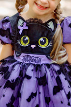 Load image into Gallery viewer, A close-up of a Halloween costume dress with a large black cat face applique on the bodice, purple bat-print tulle skirt, and 'HALLOWEEN' embroidery at the waist.