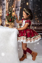 Load image into Gallery viewer, Side view of girl in boutique Christmas dress with wreath embroidery and twirl skirt enjoying the holiday season.