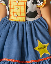 Load image into Gallery viewer, Close-up of girls cowgirl dress with yellow checked bodice, decorative buttons, chambray skirt and embroidered sheriff badge