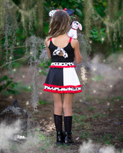 Load image into Gallery viewer, Back view of a black and white girls Halloween active dress showing the full twirl skirt.