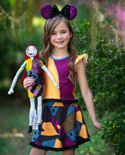 Load image into Gallery viewer, Girl wearing a playful patchwork Halloween dress with flutter sleeves and comfortable athletic fabric.