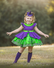 Load image into Gallery viewer, Girl wearing a boutique Halloween dress with a full twirl skirt and spider web pattern.