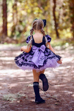 Load image into Gallery viewer, Back of a Halloween party dress with oversized bow and full twirl skirt.