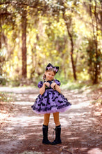 Load image into Gallery viewer, Front view of a boutique girls Halloween dress with bat and cat print, flutter sleeves, and twirl skirt.
