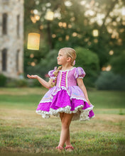 Load image into Gallery viewer, Girl wearing a purple princess dress with pink lace bodice, striped puff sleeves and embroidered skirt