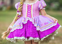 Load image into Gallery viewer, Close-up of girls purple princess dress with lace-up bodice, embroidered overskirt and layered purple lace