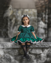 Load image into Gallery viewer, Girls vintage Halloween dress featuring green and black stripes, white eyelet collar, puff sleeves, and a full twirl skirt.