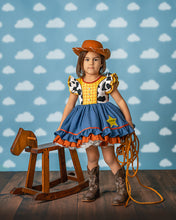 Load image into Gallery viewer, Girls western costume dress with cow print bodice, yellow checks, blue ruffle skirt and embroidered sheriff badge