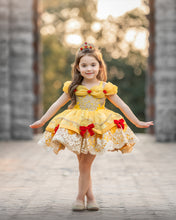 Load image into Gallery viewer, Girl wearing yellow fairytale princess dress with gold embroidered lace, red bows and full layered skirt