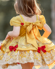 Load image into Gallery viewer, Back view of girls yellow princess costume with satin bow, red velvet bows and ornate embroidered lace