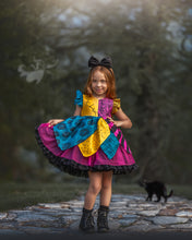 Load image into Gallery viewer, Front view of Sally inspired boutique dress for girls with colorful patchwork skirt