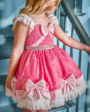 Load image into Gallery viewer, Close-up of pink lace princess dress with satin bow bodice, pearl trim, ruffled shoulders and full lace skirt