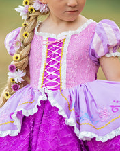 Load image into Gallery viewer, Close-up of purple princess dress with ribbon lace-up bodice, pink lace, puff sleeves and embroidered skirt