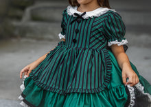 Load image into Gallery viewer, Ruffled apron detail with lace edging on a boutique vintage Halloween dress.